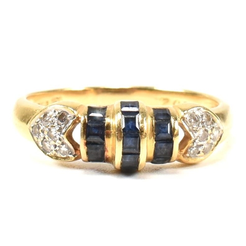 250A - An 18ct yellow gold sapphire and diamond ring. The ring having central domed calibre cut sapphires t... 