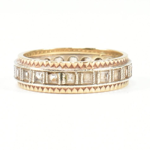 251 - A hallmarked 9ct gold and white stone eternity ring. The two tone metal ring set with a central row ... 