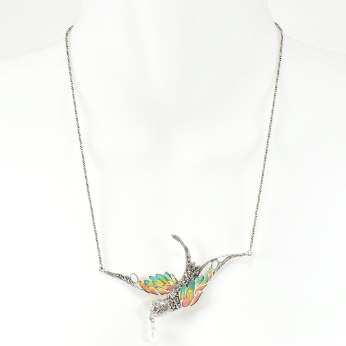 253 - A silver plique-a-jour bird in flight necklace. The necklace having a silver and plique-a-jour swall... 