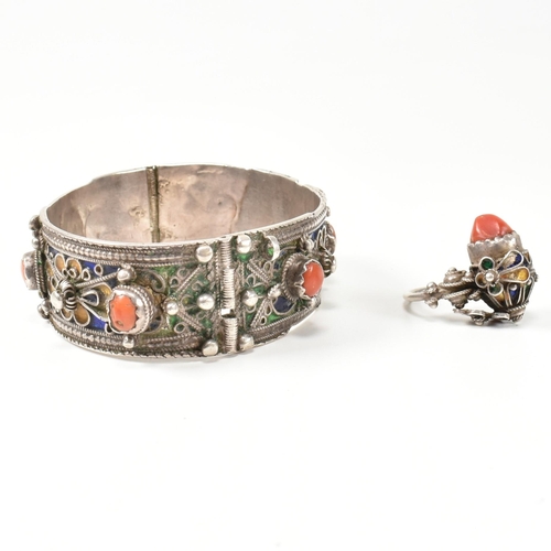 259 - An African Berber Kabyle silver, coral and enamel bangle and earring/ring. The traditional Kabyle si... 