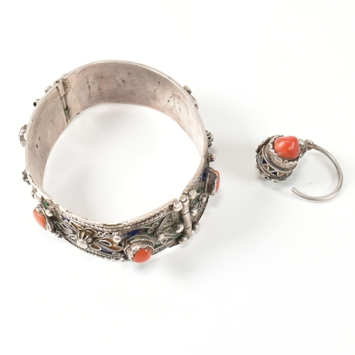 259 - An African Berber Kabyle silver, coral and enamel bangle and earring/ring. The traditional Kabyle si... 