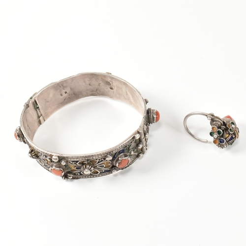 259 - An African Berber Kabyle silver, coral and enamel bangle and earring/ring. The traditional Kabyle si... 