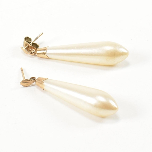 260 - A 9ct rolled gold hinged bracelet and a pair of 9ct gold and simulated pearl pendant earrings. The 9... 