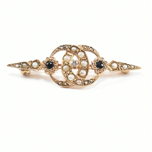 266 - A hallmarked 9ct gold, sapphire, diamond and seed pearl brooch pin. The brooch pin having a central ... 