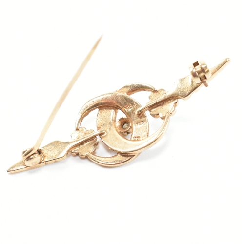 266 - A hallmarked 9ct gold, sapphire, diamond and seed pearl brooch pin. The brooch pin having a central ... 