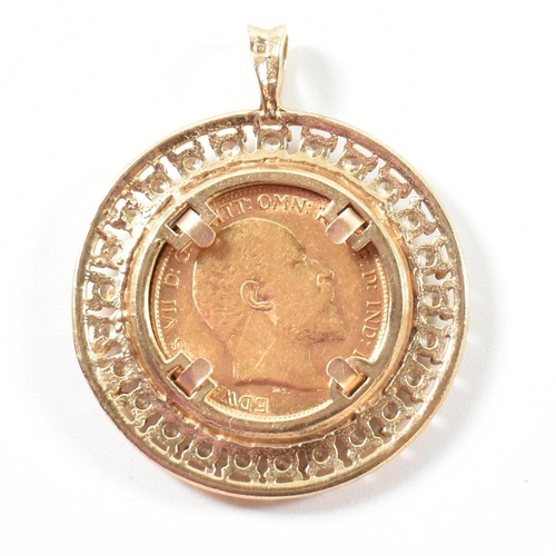 27 - A hallmarked 9ct gold Edwardian half sovereign mounted necklace pendant. The pendant set with a 1906... 