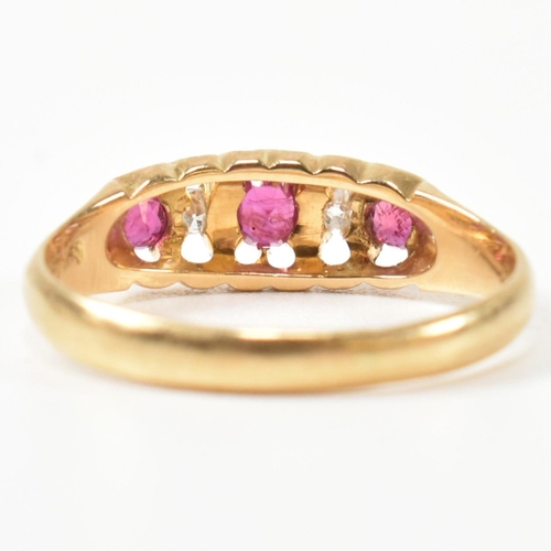 272 - An early 20th century hallmarked 18ct gold, ruby and diamond gypsy ring. The ring having a central o... 