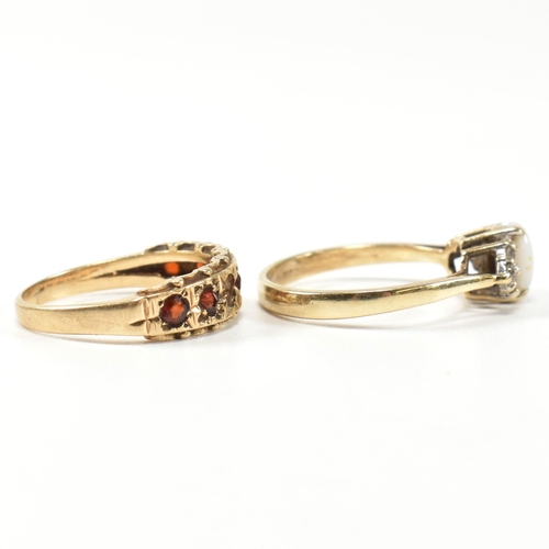 274 - Two hallmarked gold and gem set rings. The rings to include a hallmarked 9ct gold, opal and CZ ring,... 