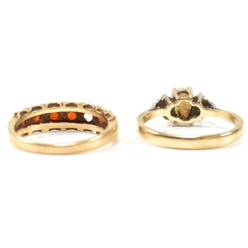 274 - Two hallmarked gold and gem set rings. The rings to include a hallmarked 9ct gold, opal and CZ ring,... 