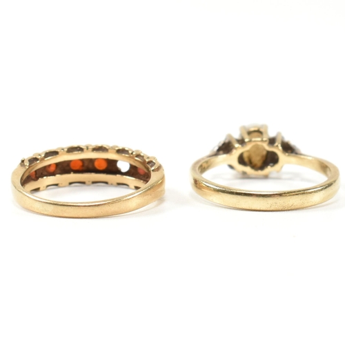 274 - Two hallmarked gold and gem set rings. The rings to include a hallmarked 9ct gold, opal and CZ ring,... 