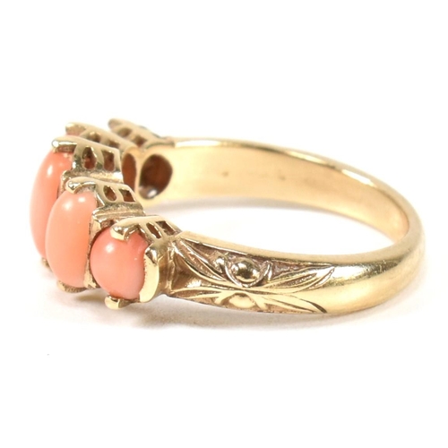 276 - A hallmarked 9ct gold and coral five stone ring. The ring set with five oval opal cabochons to a tex... 