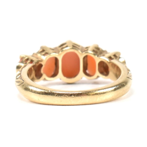 276 - A hallmarked 9ct gold and coral five stone ring. The ring set with five oval opal cabochons to a tex... 