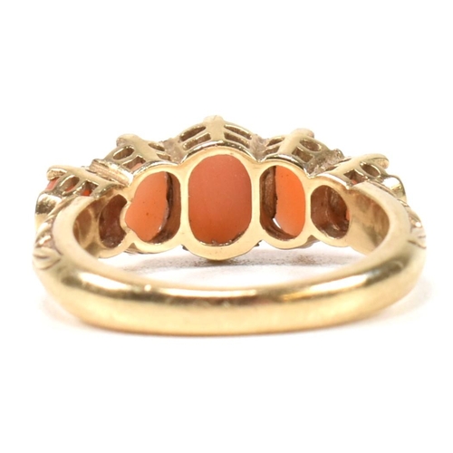 276 - A hallmarked 9ct gold and coral five stone ring. The ring set with five oval opal cabochons to a tex... 