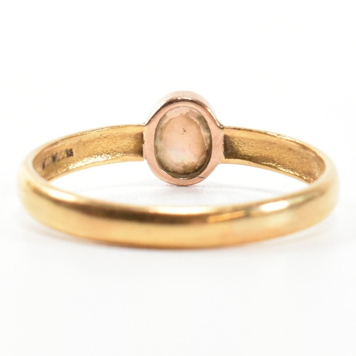 278 - A Victorian hallmarked 22ct gold and opal ring. The ring having a single oval cut opal cabochon with... 