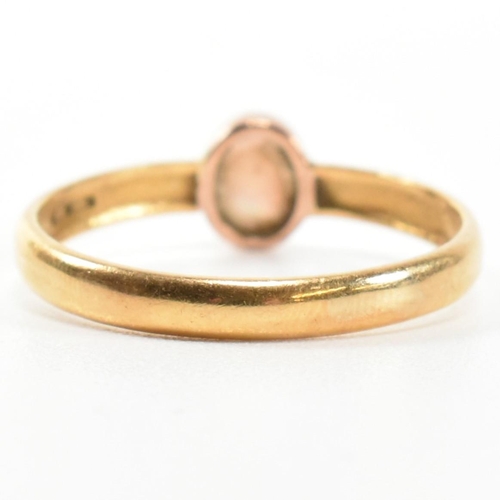 278 - A Victorian hallmarked 22ct gold and opal ring. The ring having a single oval cut opal cabochon with... 