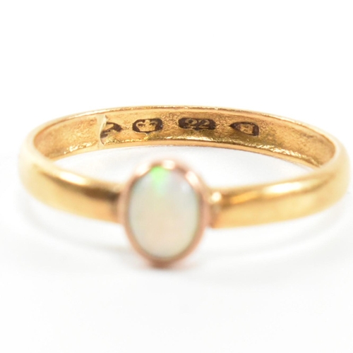 278 - A Victorian hallmarked 22ct gold and opal ring. The ring having a single oval cut opal cabochon with... 