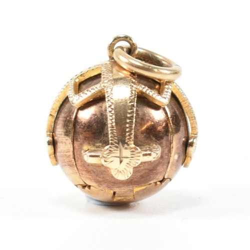 287 - A hallmarked 9ct gold Masonic orb fob pendant. The orb pendant opening out into the form of a cross.... 