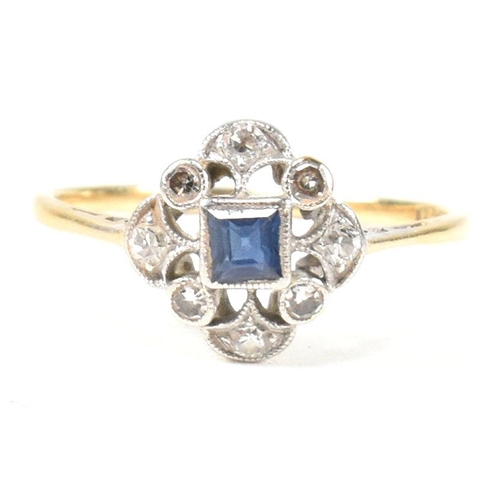 29 - A 1920S 18ct gold sapphire and diamond cluster ring. The ring set with a central sapphire with singl... 