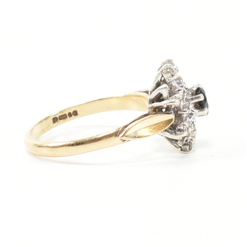 290 - A hallmarked 9ct gold, diamond and sapphire cluster ring. The ring having a central round cut sapphi... 