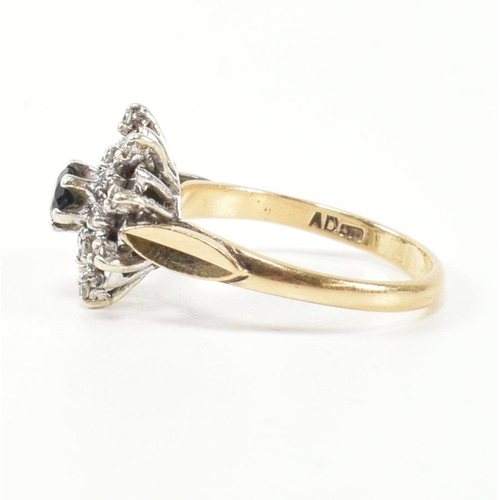 290 - A hallmarked 9ct gold, diamond and sapphire cluster ring. The ring having a central round cut sapphi... 