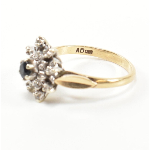 290 - A hallmarked 9ct gold, diamond and sapphire cluster ring. The ring having a central round cut sapphi... 