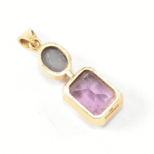 292 - A hallmarked 18ct gold, amethyst and star sapphire necklace pendant. The 18ct gold necklace pendant ... 