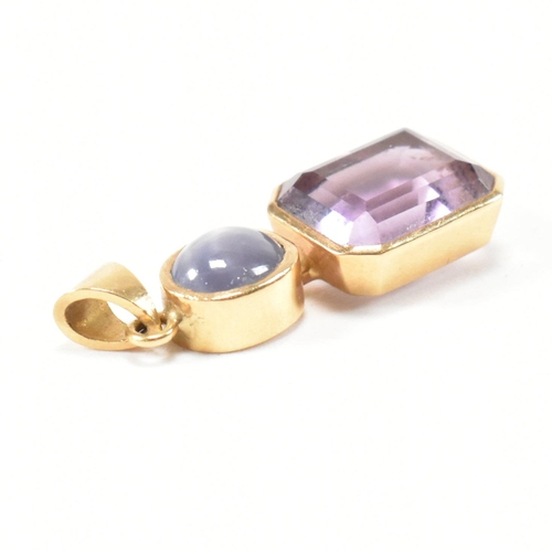 292 - A hallmarked 18ct gold, amethyst and star sapphire necklace pendant. The 18ct gold necklace pendant ... 