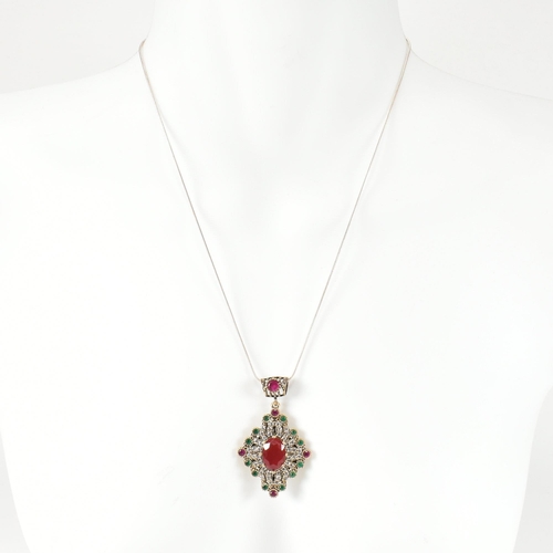 295 - A 925 silver and gem set pendant necklace. The necklace strung with a silver pendant set with synthe... 