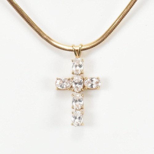 296 - A hallmarked 9ct gold and gem set CZ cross pendant necklace. The 9ct gold necklace having a cross pe... 