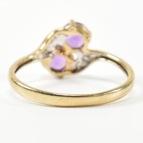 302 - A hallmarked 9ct gold, amethyst and diamond cross over ring. The ring having two round cut amethysts... 