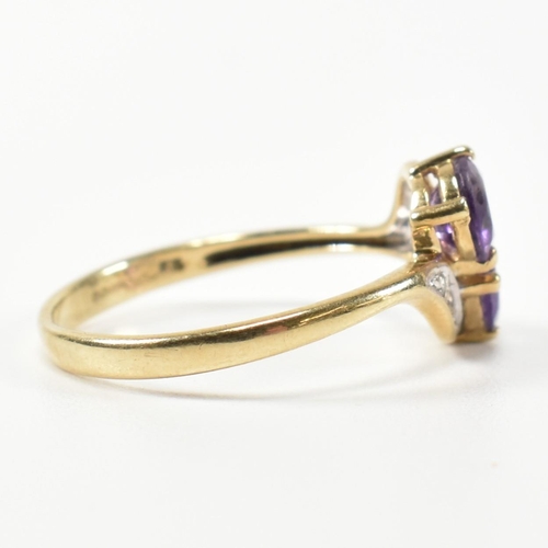 302 - A hallmarked 9ct gold, amethyst and diamond cross over ring. The ring having two round cut amethysts... 