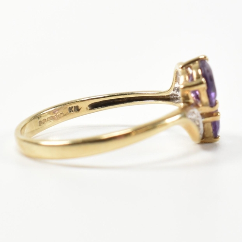 302 - A hallmarked 9ct gold, amethyst and diamond cross over ring. The ring having two round cut amethysts... 