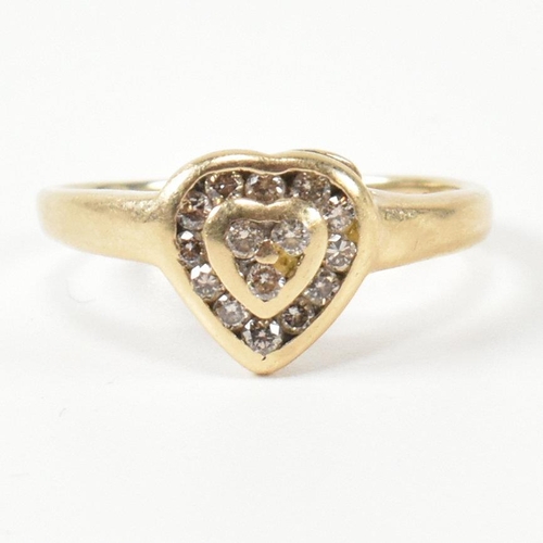 306 - A hallmarked 9ct gold and diamond heart cluster ring. The ring having three round cut diamonds to th... 