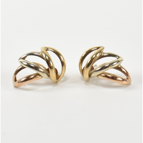 307 - A pair of hallmarked 9ct gold three tone wreath earrings. The stud earrings having a laurel wreath d... 