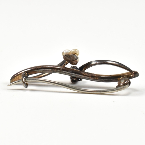 31 - An early 20th century gold diamond and pearl brooch pin. The brooch in the form of a branch with old... 