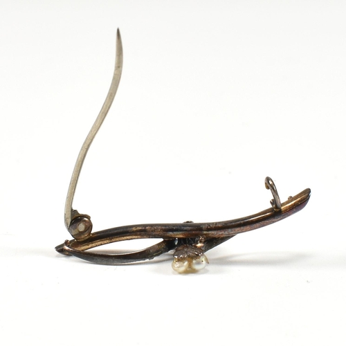 31 - An early 20th century gold diamond and pearl brooch pin. The brooch in the form of a branch with old... 