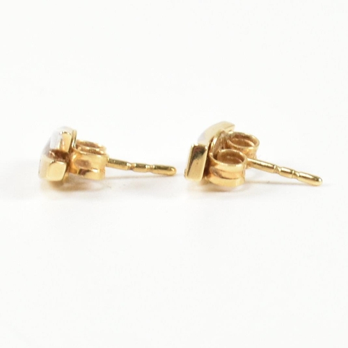 312 - A pair of 18ct gold and diamond stud earrings. The earrings having a two tone yellow and white gold ... 