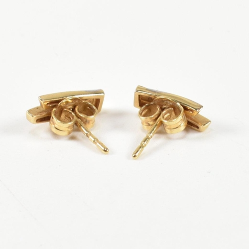 312 - A pair of 18ct gold and diamond stud earrings. The earrings having a two tone yellow and white gold ... 