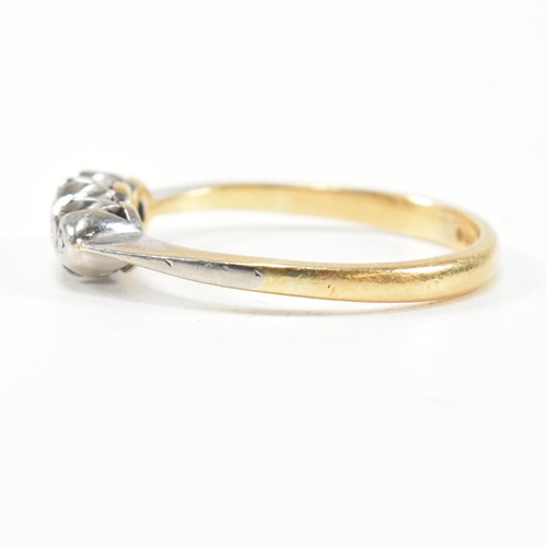 314 - A 9ct gold, platinum and diamond three stone ring. The ring having a single row of three round cut d... 