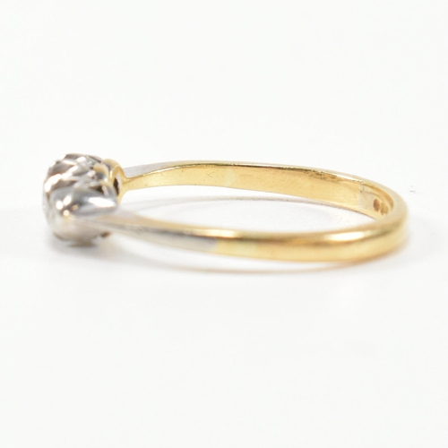 314 - A 9ct gold, platinum and diamond three stone ring. The ring having a single row of three round cut d... 