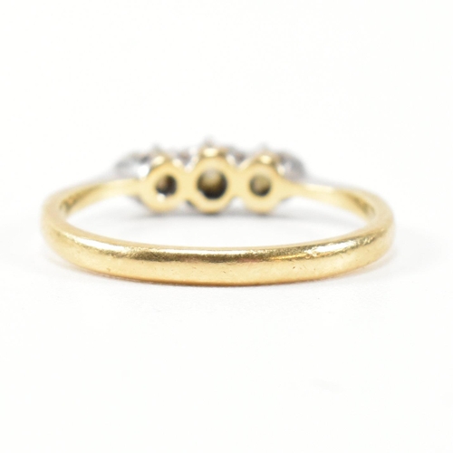 314 - A 9ct gold, platinum and diamond three stone ring. The ring having a single row of three round cut d... 