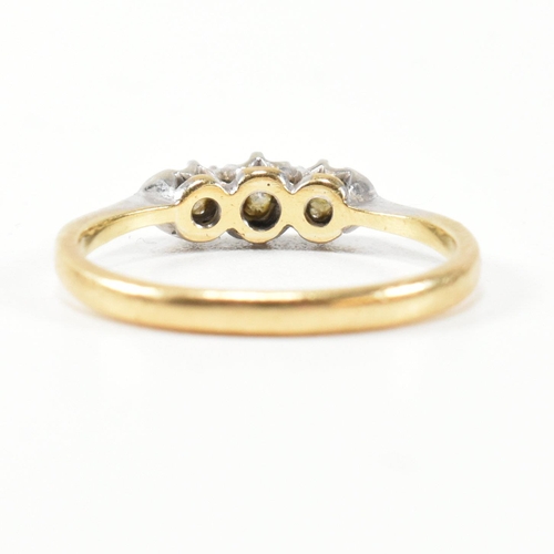 314 - A 9ct gold, platinum and diamond three stone ring. The ring having a single row of three round cut d... 