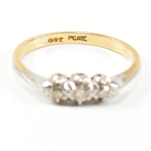 314 - A 9ct gold, platinum and diamond three stone ring. The ring having a single row of three round cut d... 