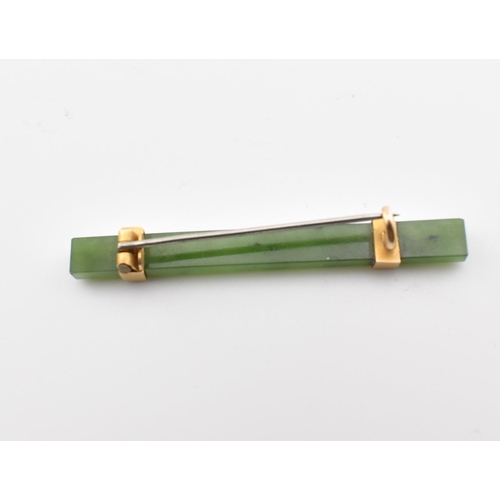 316 - A vintage nephrite & yellow metal bar brooch pin. The brooch comprised of a rectangular cut mottled ... 