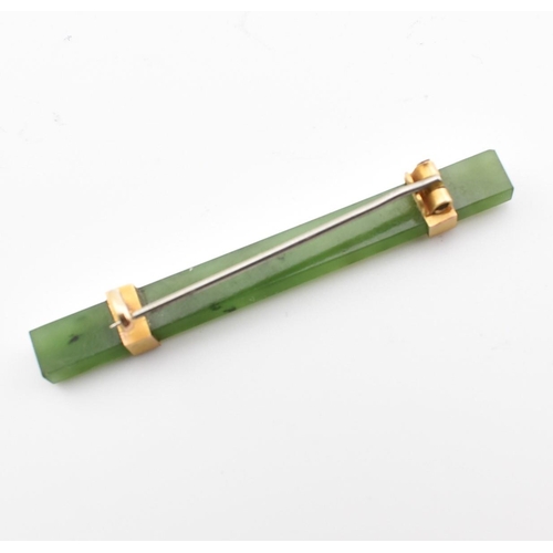 316 - A vintage nephrite & yellow metal bar brooch pin. The brooch comprised of a rectangular cut mottled ... 