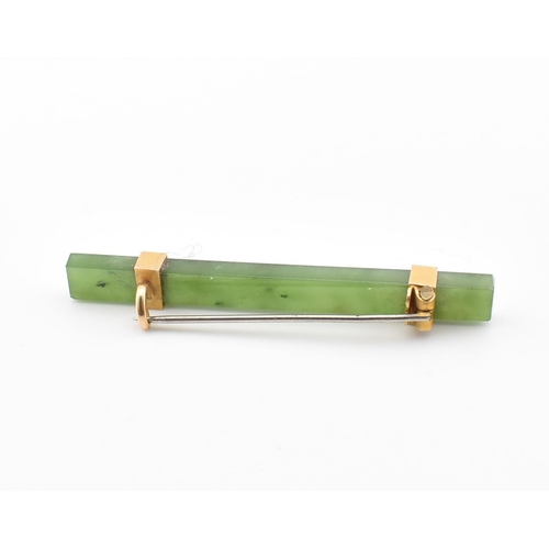 316 - A vintage nephrite & yellow metal bar brooch pin. The brooch comprised of a rectangular cut mottled ... 