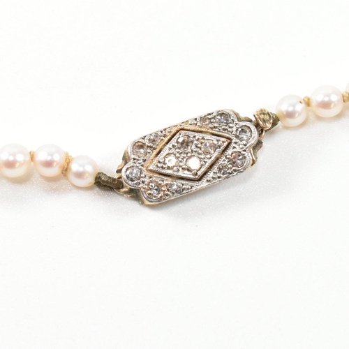 317 - A 9ct gold, cultured pearl and diamond necklace. The necklace having a single row of graduated cultu... 