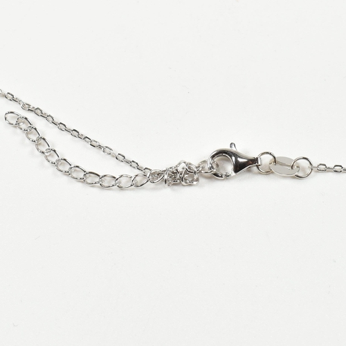 318 - A designer style silver pendant necklace. The necklace strung with a CZ encrusted leopard pendant. P... 