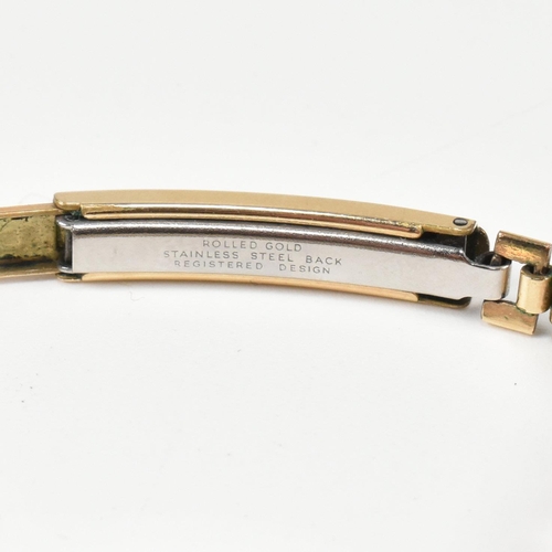 319 - A hallmarked 9ct gold Audax ladies dress watch with rolled gold bracelet strap. The watch dial havin... 