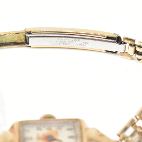 319 - A hallmarked 9ct gold Audax ladies dress watch with rolled gold bracelet strap. The watch dial havin... 